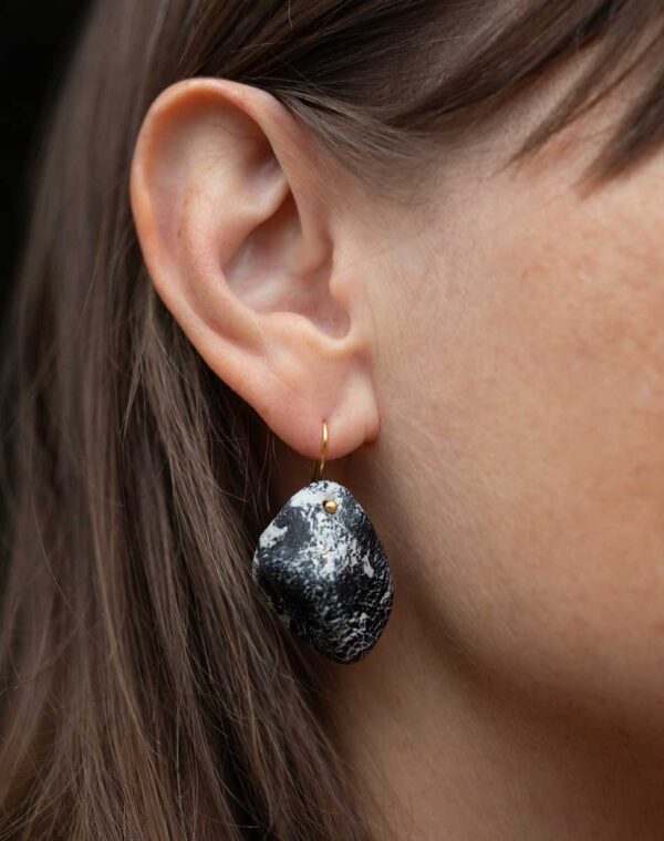 Hand-sculpted earrings.